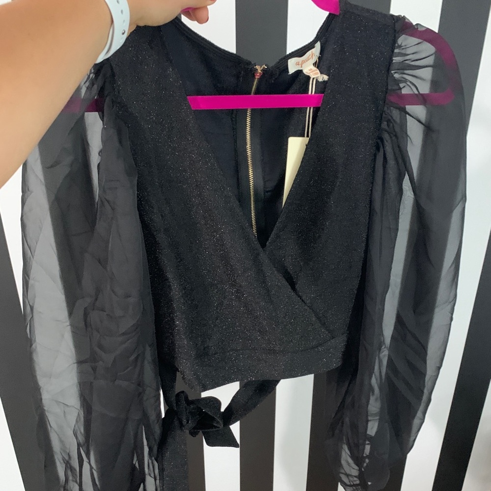Black sparkly. Sheer Sleeve. Deep V